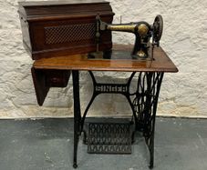 Vintage Singer Cast Iron Sewing Table with Jones 6400 Machine.