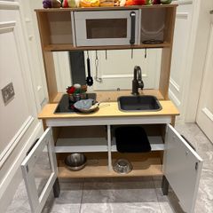 kids play kitchen complete with pots, pans,utensils and food (meat,fosh,fruit and veg)