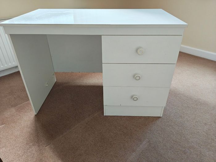 White desk with three good sized drawers.