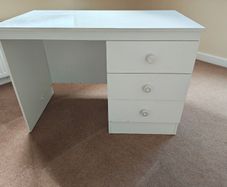 White desk with three good sized drawers.