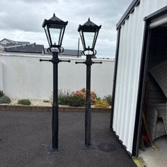 2   6 ft high lawn lights with one head.