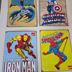 Vintage tin Batman, Captain America, Iron Man, and Spider-Man.