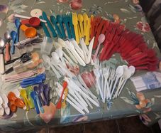 Mixture of plastic cutlery,2 metal spoons,measuring spoons/cups and mini straws