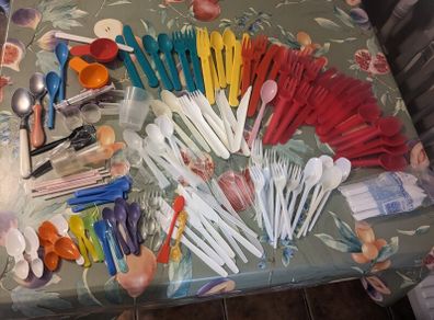 Mixture of plastic cutlery,2 metal spoons,measuring spoons/cups and mini straws