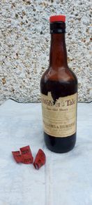 vintage bottle of winters tale sherry 3/4 full ,found in a old pub closed down,