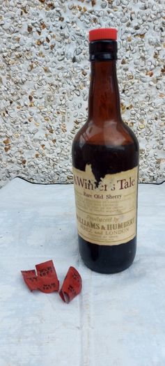 vintage bottle of winters tale sherry 3/4 full ,found in a old pub closed down,