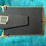 gold-toned metal 5x7 picture frame with decorative floral embellishments. Image 2