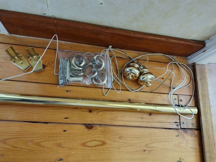 Brass coloured curtain track