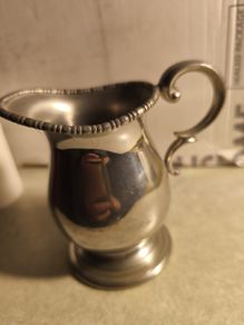 Pewter rmilk jug.