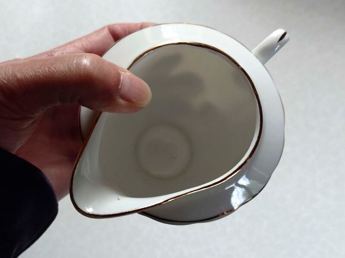 Milk Jug & 4 Saucers (used).