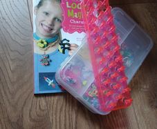loom bands box, tool, and book.