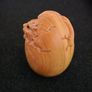 Carved wooden dragon hatching from an egg. Image 5
