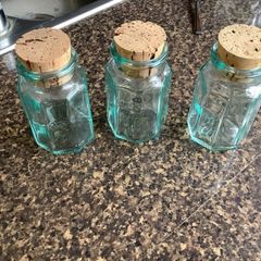 Set of three vintage green tinge bottles