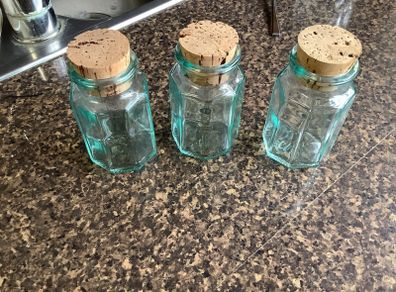 Set of three vintage green tinge bottles