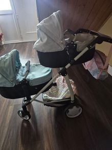 Twin pram and changing bag and 3 dolls