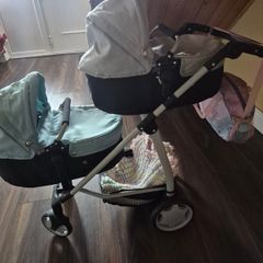 Twin pram and changing bag and 3 dolls