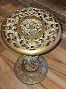 A Beautiful Old Hollywood Regency Brass Filigree Plant Stand Ornate Scrollwork features intricate, ornate pierced cut-work in a circular design