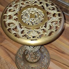 A Beautiful Old Hollywood Regency Brass Filigree Plant Stand Ornate Scrollwork features intricate, ornate pierced cut-work in a circular design