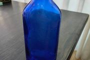 Large blue glass bottle