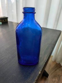Large blue glass bottle