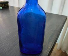 Large blue glass bottle