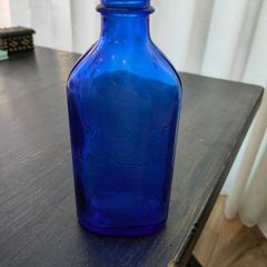 Large blue glass bottle