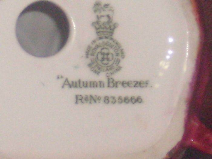 a royal doulton figure of a girl