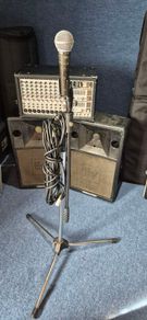 Small PA System plus microphone and stand.