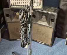 Small PA System plus microphone and stand.