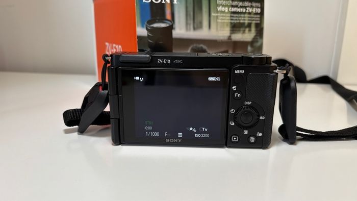 Sony ZVE-10 + Sony E 18-105mm f/4 lens (cage and 5 batteries)