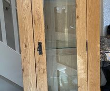 Solid oak glass cabinet with light