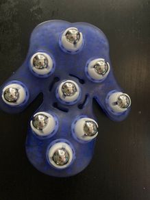 Palm-shaped manual massage glove with roller balls