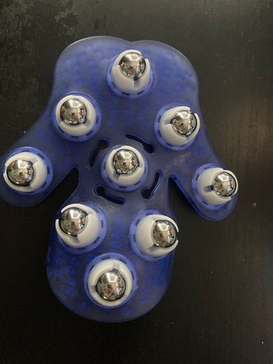 Palm-shaped manual massage glove with roller balls