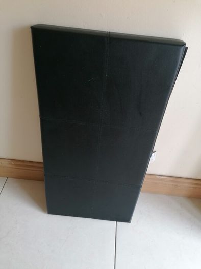 Black faux-leather folding storage ottoman