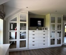 White mirror fitted wardrobes with 10 drawer chest