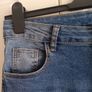 Mid-wash Distressed Jeans with Cuffed Hem. Image 2