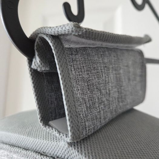 Grey fabric hanging closet organizer with 6 open shelves and side mesh pockets