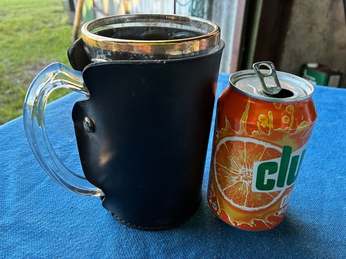 Vintage pint glass in leather holder