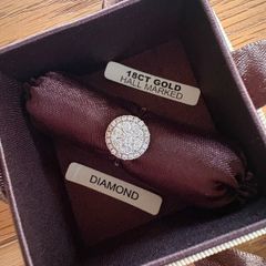 Diamond cluster engagement ring