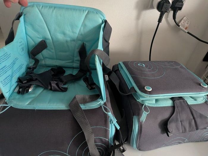 munchkin travel booster seat for restaurant etc.