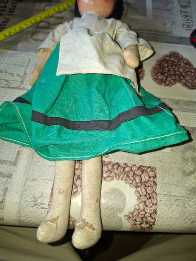 Vintage 1940s Papier Mache Doll, featuring a painted face on a soft fabric body,