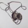 a silver locket with a silver chain Image 3