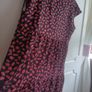 A-line tiered dress with red and black print. Image 4