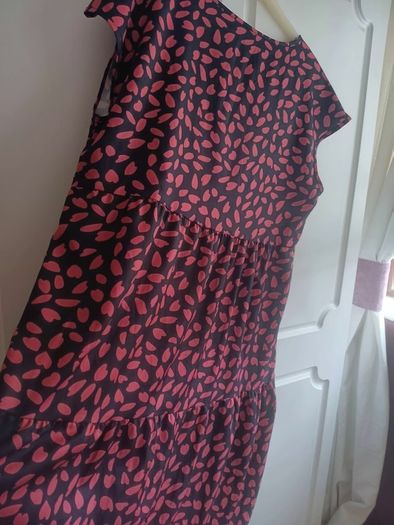 A-line tiered dress with red and black print.