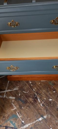 Chest drawers with brass strip suitcase set down