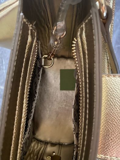 Juicy Couture gold handbag
