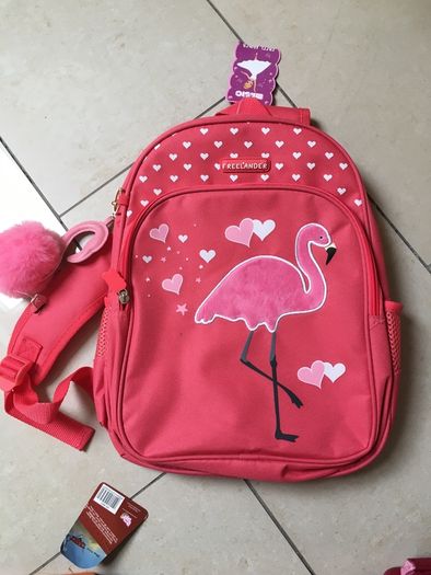 Two NEW school bags. Disney Planes pull along. Pink Flamingo back pack.