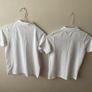 2 dunnes white polo shirts (as new) age 9-10 Image 6