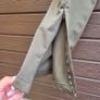 New FILA olive green athletic track pants with an elastic drawstring waistband and zippered ankle hems. Image 8