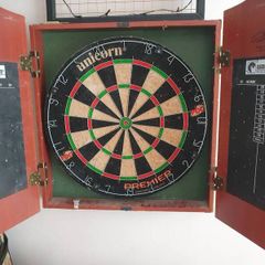 dart board in cabinet